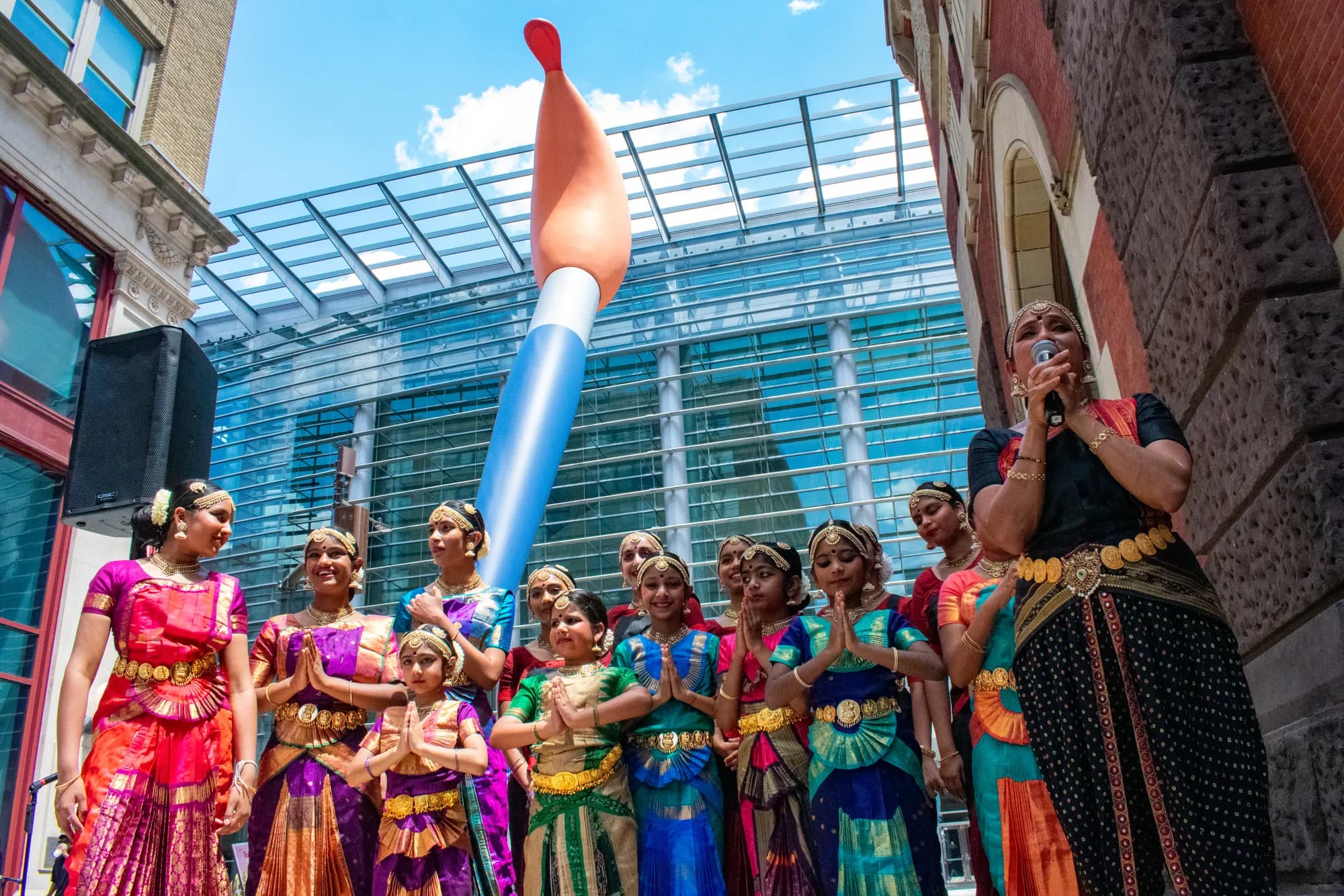 Young dancers in bright saris gathered beneath the giant paintbrush sculpture on Lenfest Plaza.