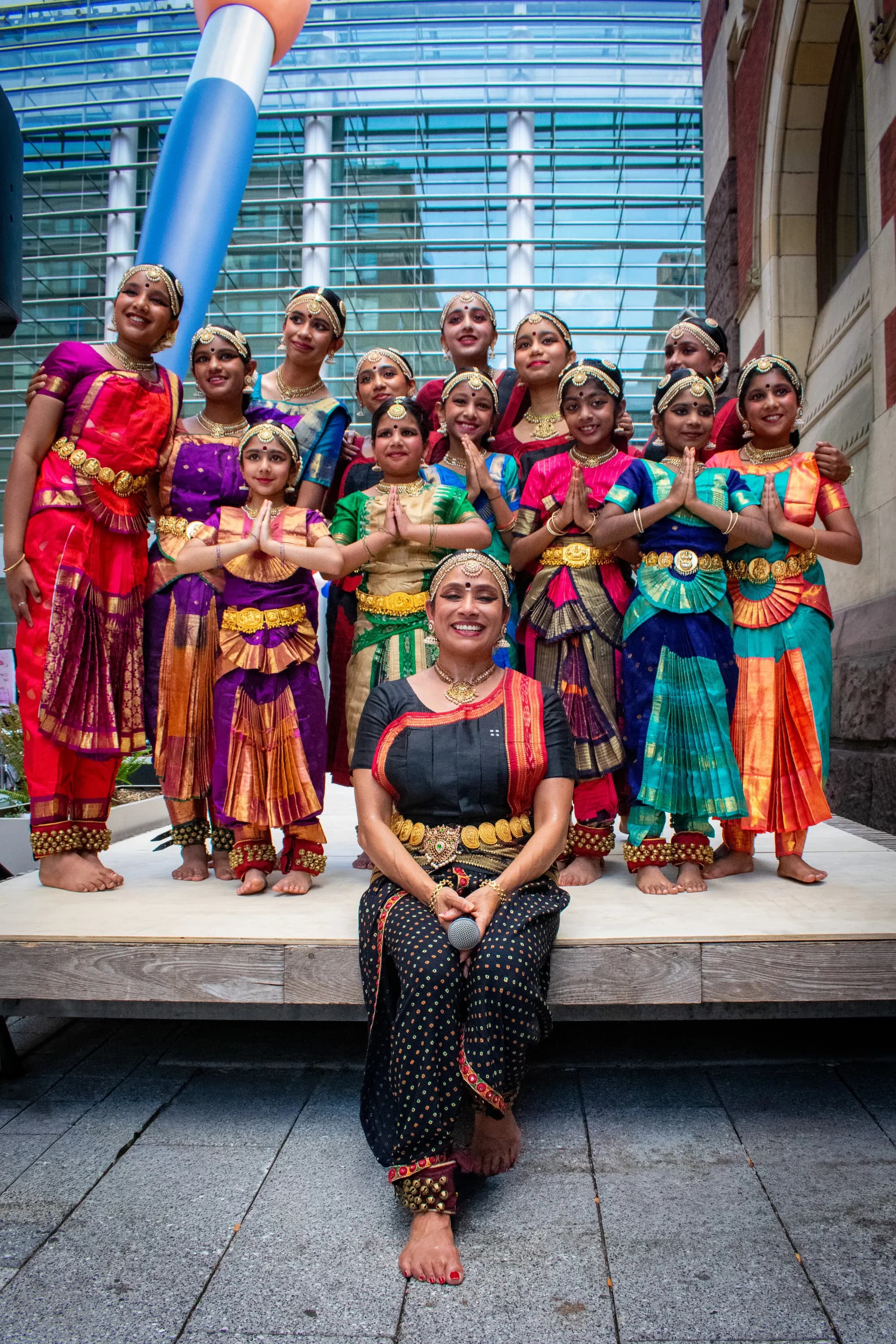 A dance troupe posed together on the steps in front of PAFA's historic facade.