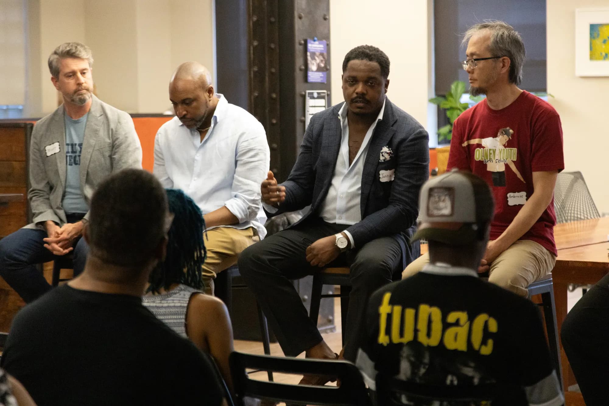 The panel listening as a question comes from the floor.